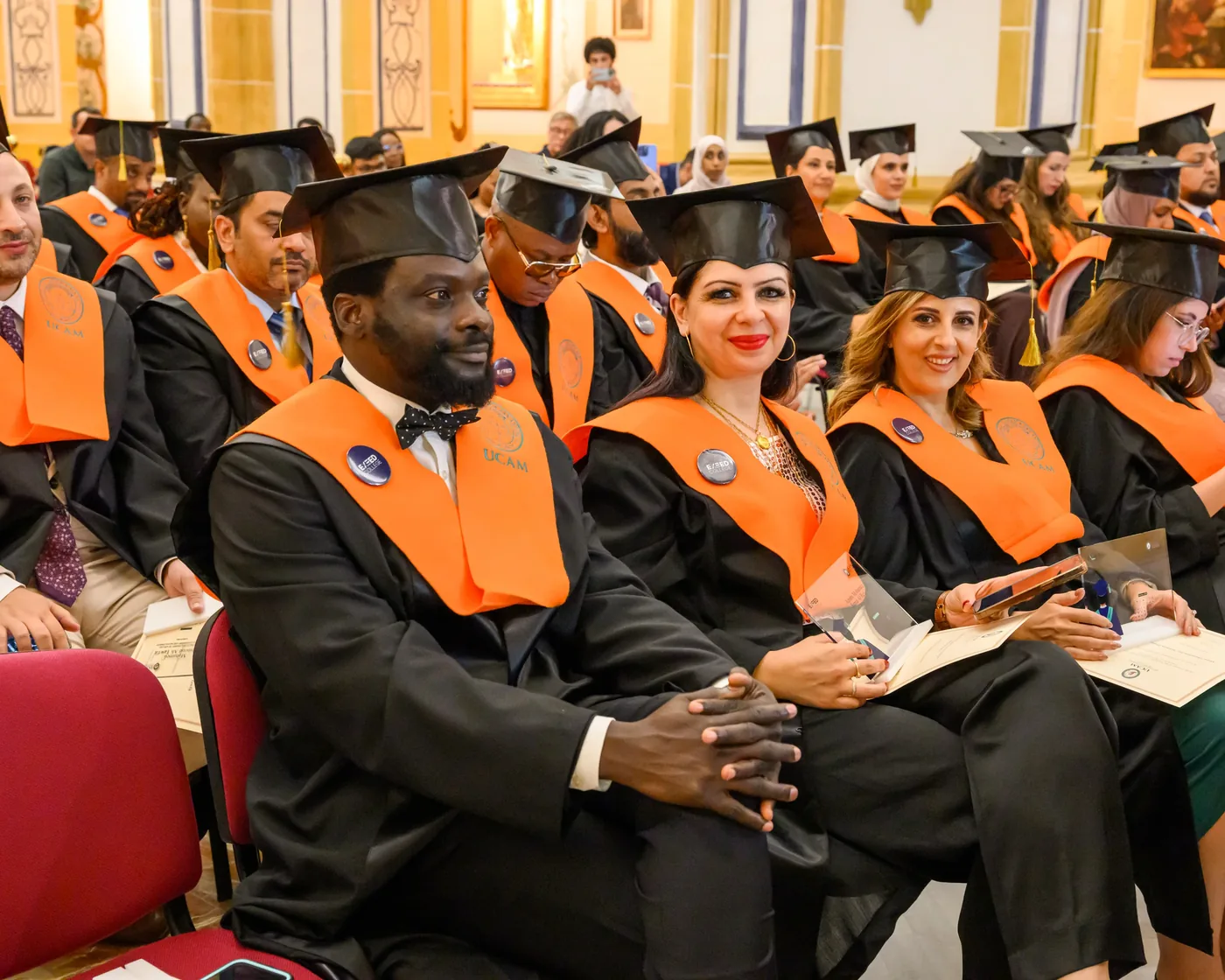 Graduates seated at the awards ceremony