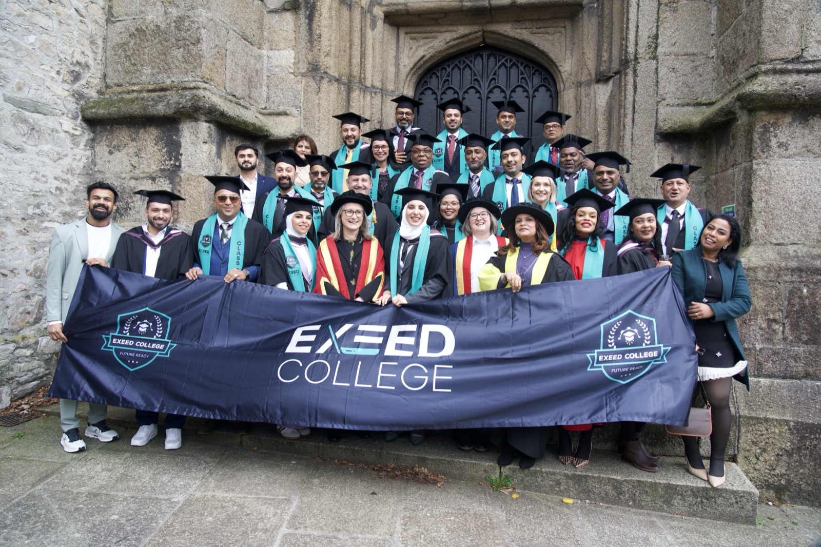 Graduates of Plymouth Marjon University outside the Minster Church of St. Andrew, Plymouth